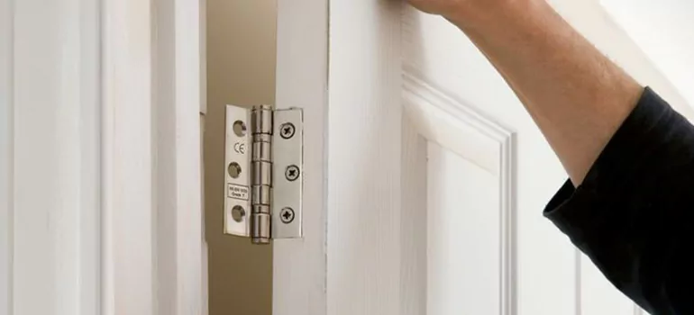 Bathroom Stall Door Hinge Repair in Four Corners, FL